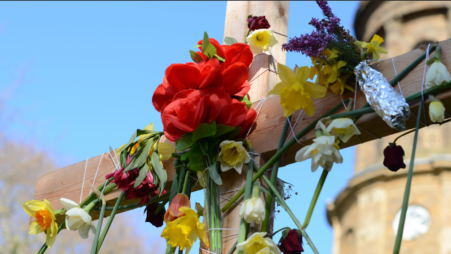 Wooden cross decorated with flowers